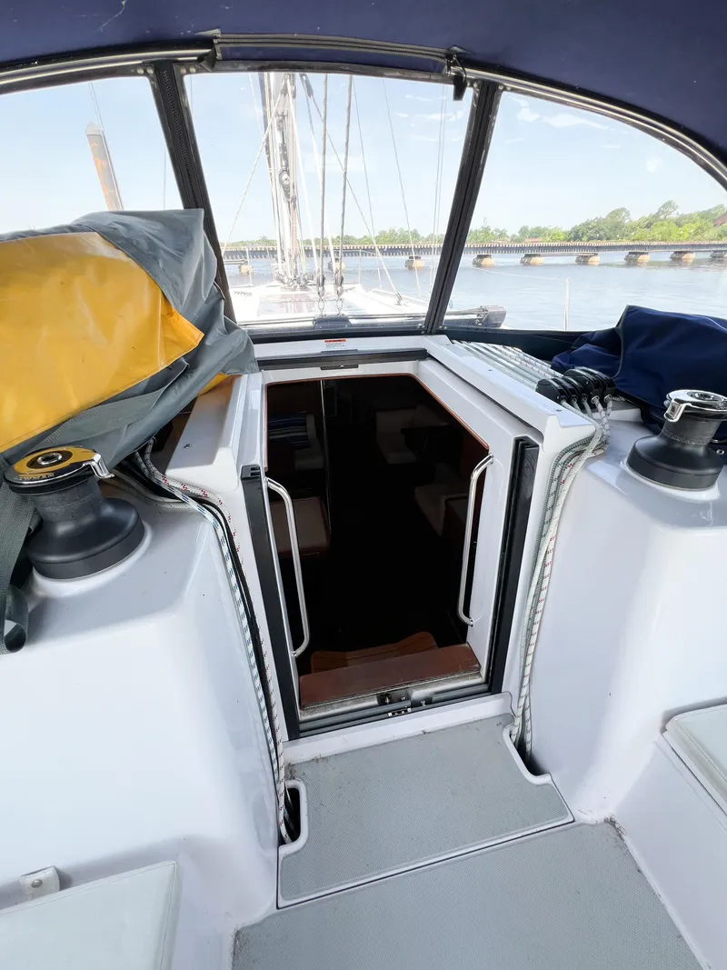 Slide: The Image of Cockpit view of 2019 Catalina 425 sailboat with open cabin door. - 7