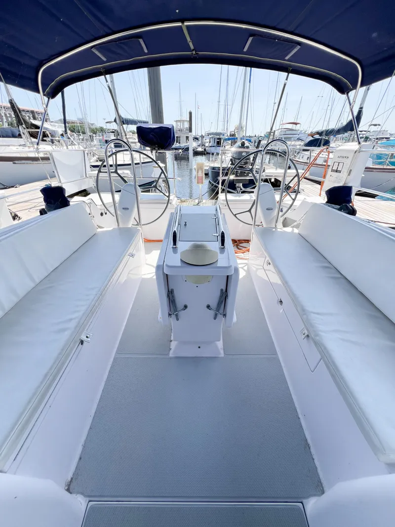 Slide: The Image of 2019 Catalina 425 sailboat cockpit with dual steering wheels and spacious seating. - 9