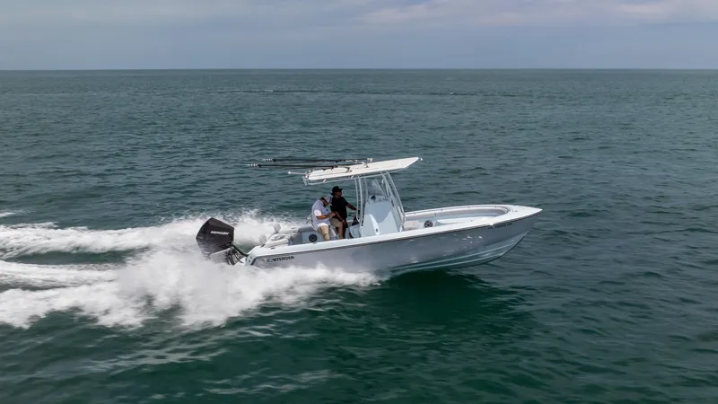 Slide: The Image of 2024 Contender 24 Sport boat cruising on open water. - 2