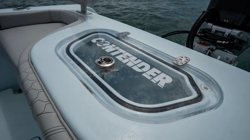 Slide: The Image of 2024 Contender 24 Sport boat detail with logo on deck, showcasing sleek design. - 31