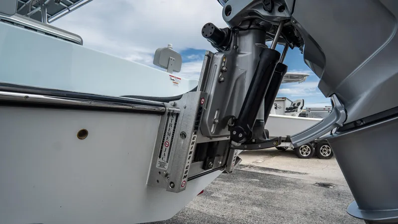 Slide: The Image of 2024 Contender 24 Sport boat engine mount detail with hydraulic components. - 43