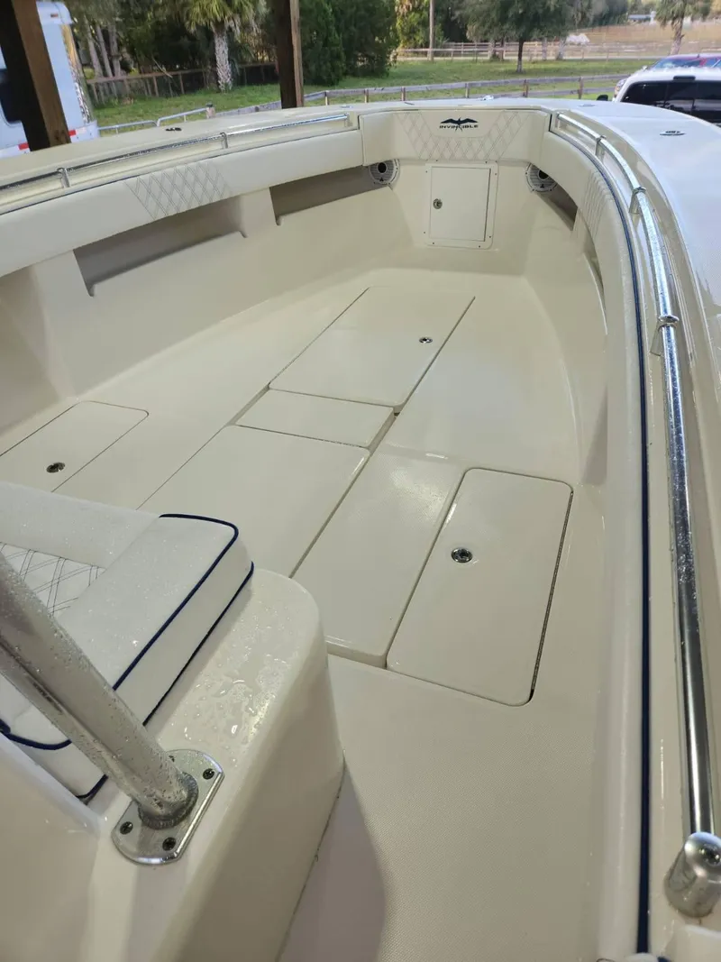 Slide: The Image of 2013 Invincible 36 Open Fisherman boat interior with spacious deck and seating. - 14