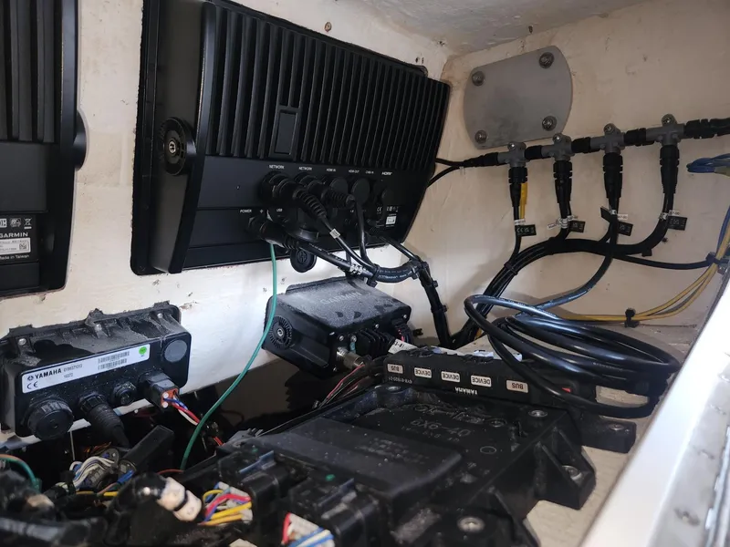 Slide: The Image of Electrical components and wiring inside a 2013 Invincible 36 Open Fisherman boat. - 22