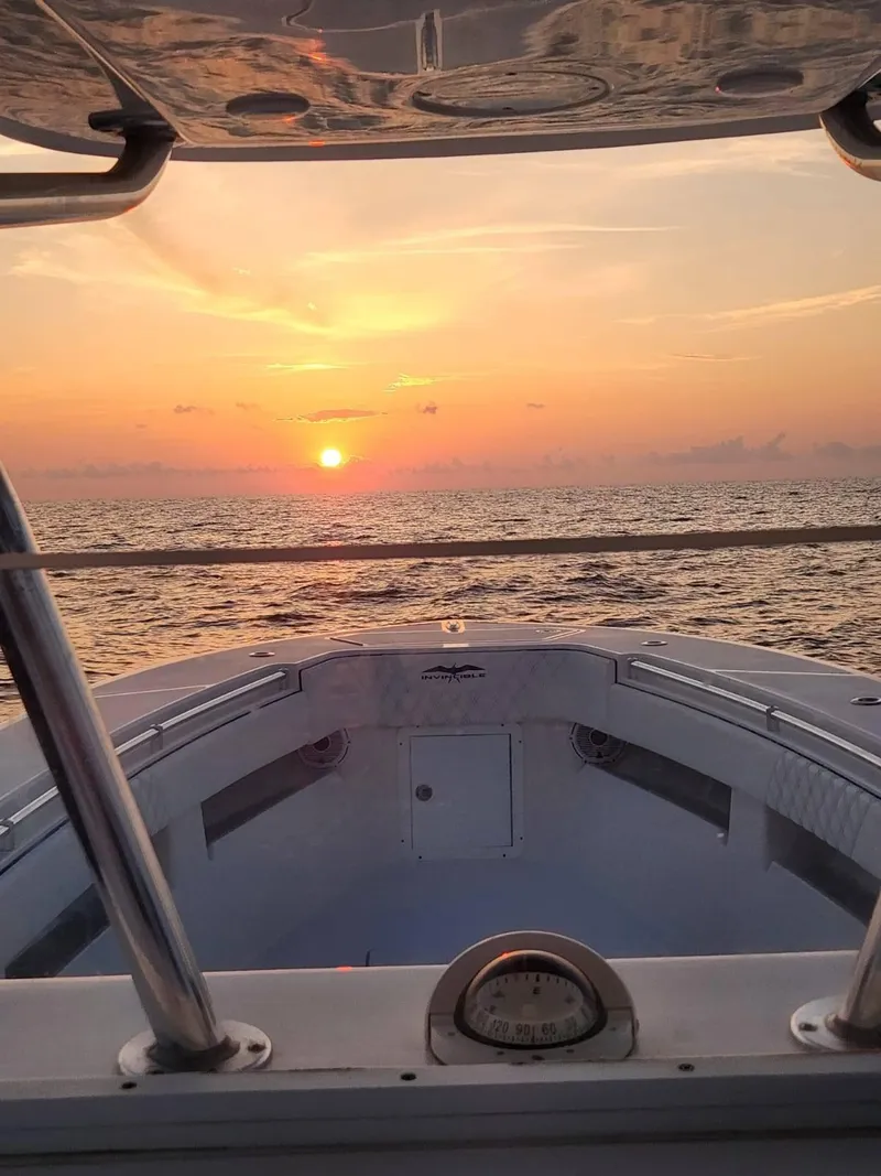 Slide: The Image of 2013 Invincible 36 Open Fisherman at sunset on the ocean. - 23