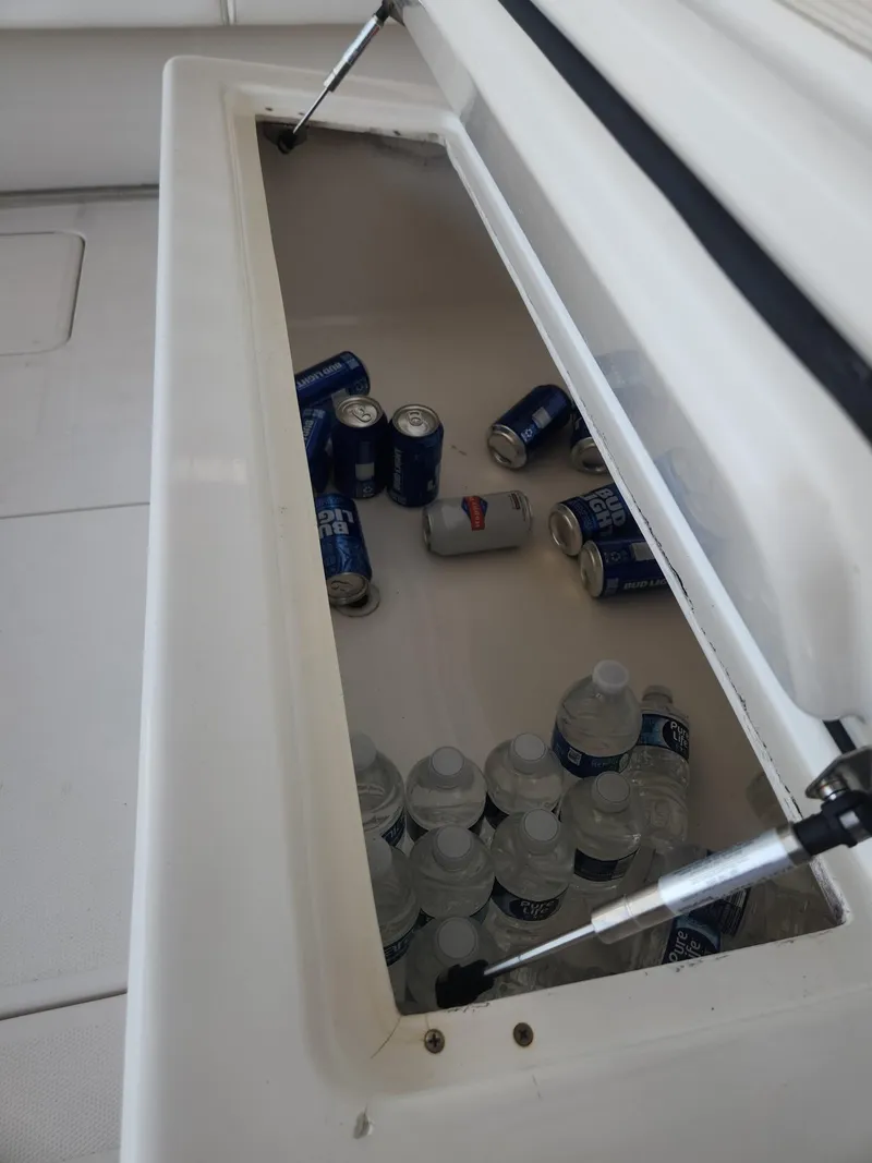 Slide: The Image of Cooler on 2013 Invincible 36 Open Fisherman with drinks and water bottles. - 24