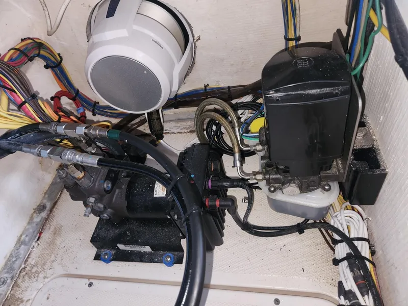 Slide: The Image of Engine compartment of a 2013 Invincible 36 Open Fisherman with wiring and components. - 25