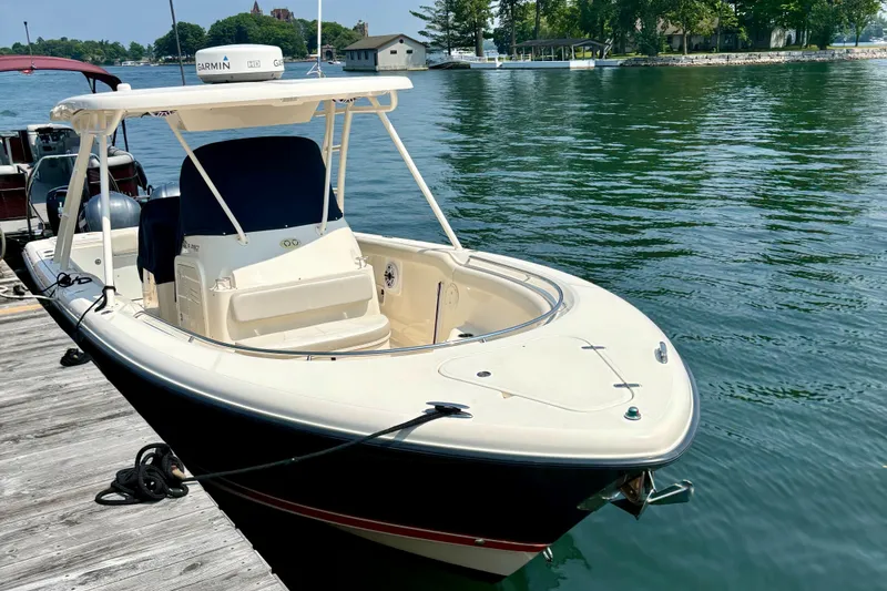 Slide: The Image of 2012 Pursuit S 280 Sport boat docked on calm water. - 3