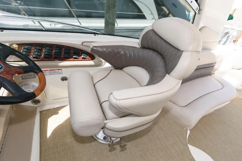 Slide: The Image of Luxurious helm seat on 2006 Sea Ray 52 Sundancer yacht, featuring plush leather upholstery. - 14