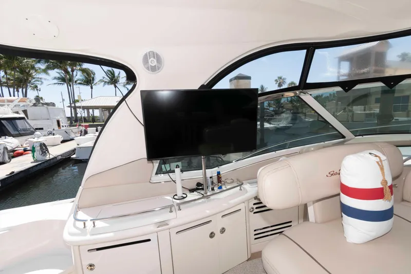 Slide: The Image of Interior of 2006 Sea Ray 52 Sundancer yacht with TV and seating area. - 15