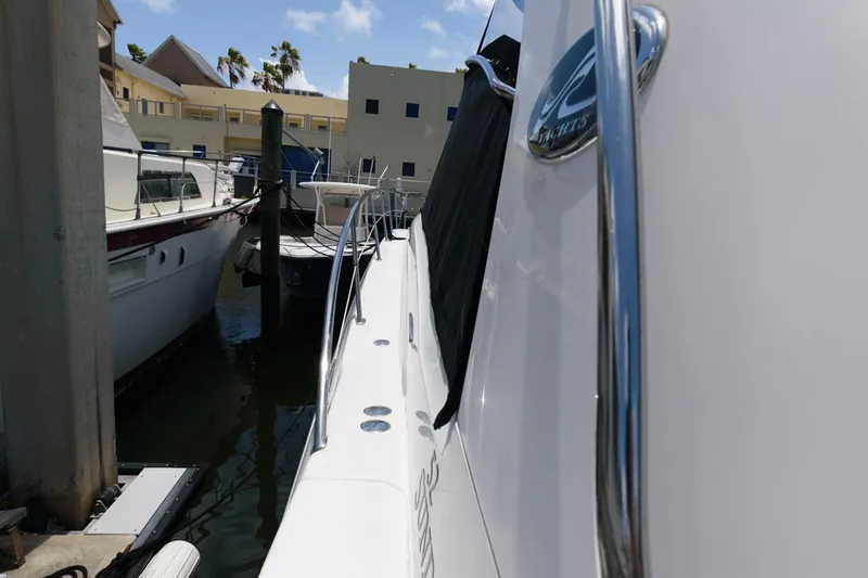 Slide: The Image of 2006 Sea Ray 52 Sundancer yacht docked at marina, side view. - 19