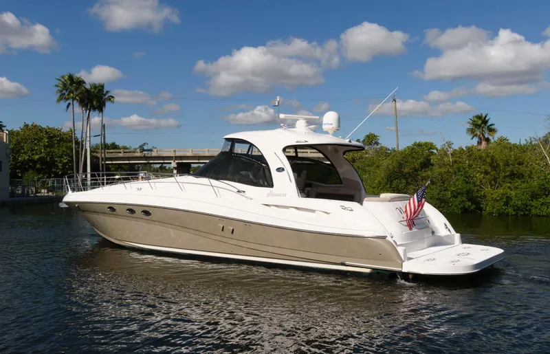 Slide: The Image of 2006 Sea Ray 52 Sundancer yacht cruising on a sunny day with blue skies. - 2