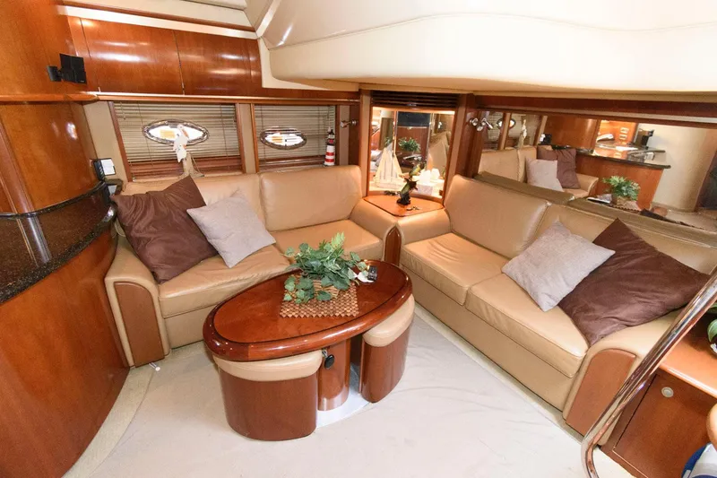Slide: The Image of Luxurious interior of 2006 Sea Ray 52 Sundancer yacht with plush seating and elegant decor. - 23