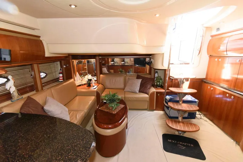 Slide: The Image of Luxurious interior of a 2006 Sea Ray 52 Sundancer yacht with elegant wood finishes. - 24