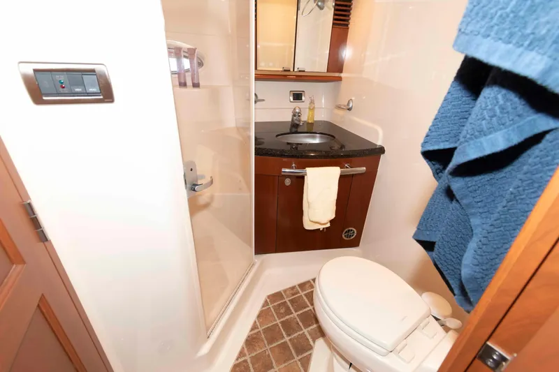 Slide: The Image of Luxurious bathroom in 2006 Sea Ray 52 Sundancer yacht with shower, sink, and toilet. - 30