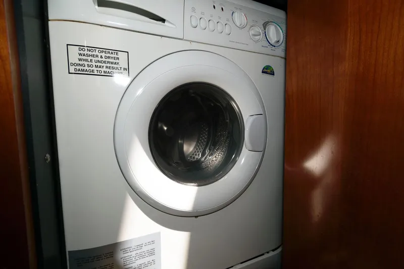 Slide: The Image of Front-loading washing machine inside a 2006 Sea Ray 52 Sundancer yacht. - 31