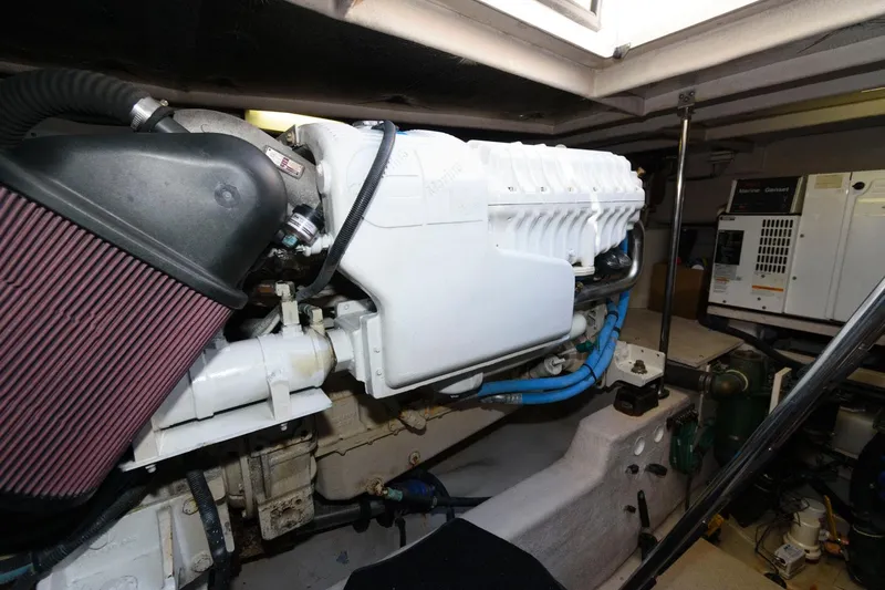 Slide: The Image of Engine room of 2006 Sea Ray 52 Sundancer with visible components and machinery. - 34