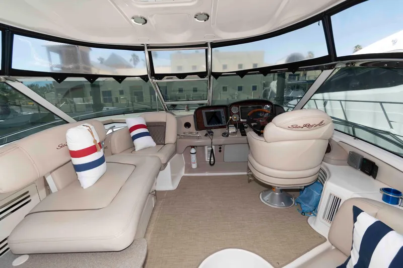 Slide: The Image of Luxurious interior of 2006 Sea Ray 52 Sundancer yacht with plush seating and helm. - 8