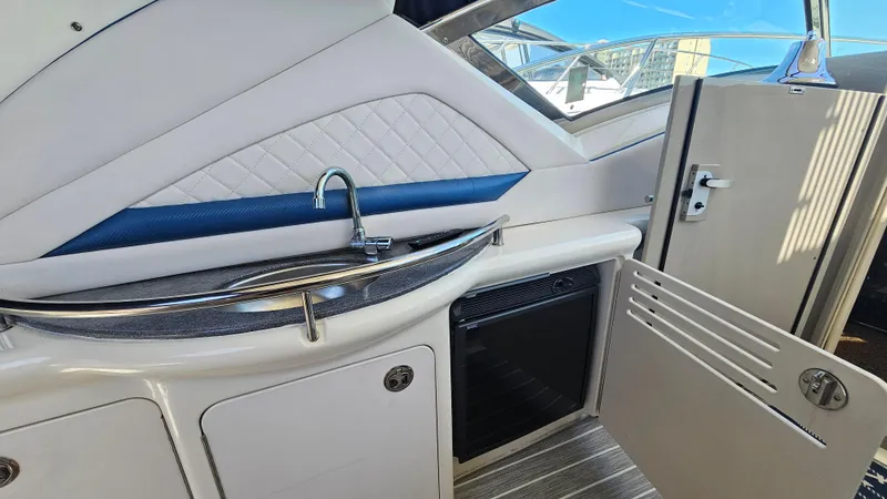Slide: The Image of 2005 Sea Ray 390 Sundancer yacht interior with sink and storage area. - 11