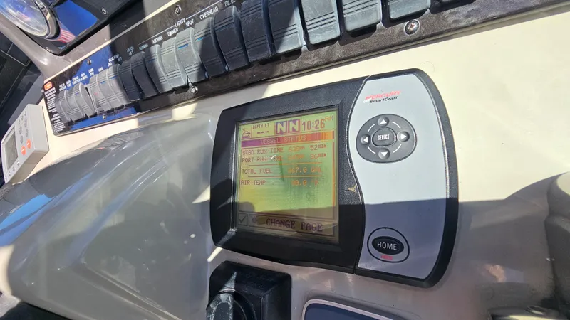 Slide: The Image of Control panel of a 2005 Sea Ray 390 Sundancer boat with navigation display. - 19