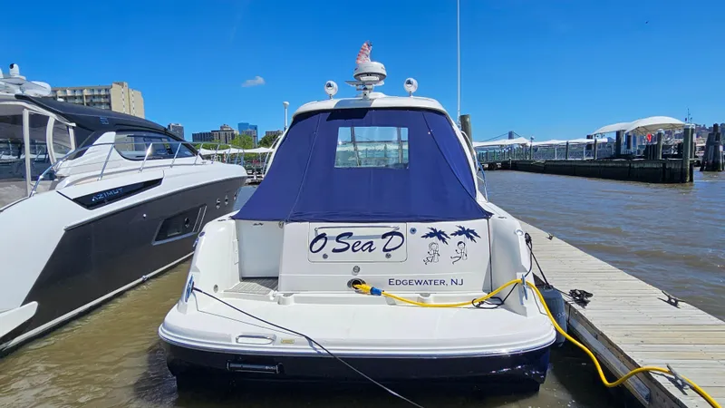 Slide: The Image of 2005 Sea Ray 390 Sundancer docked in Edgewater, NJ, under clear blue skies. - 3