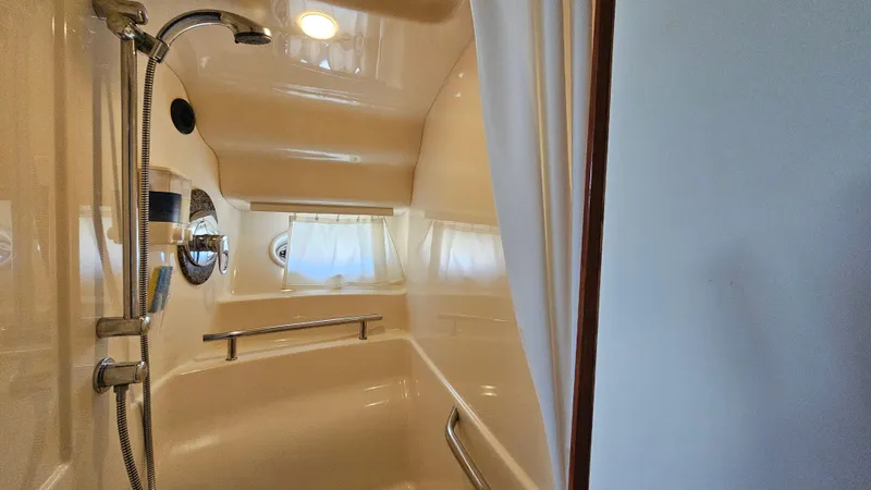 Slide: The Image of Shower area in 2005 Sea Ray 390 Sundancer yacht, featuring sleek design and modern fixtures. - 37