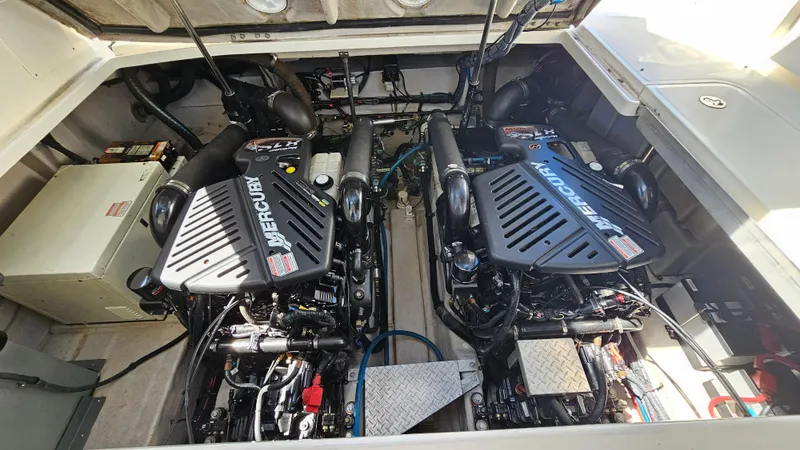 Slide: The Image of Engine compartment of a 2005 Sea Ray 390 Sundancer with twin Mercury engines. - 39