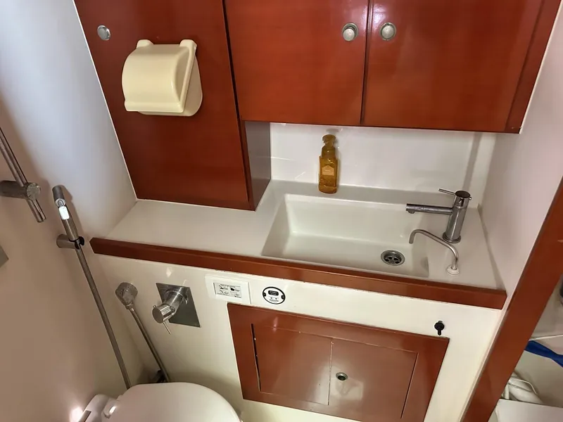 Slide: The Image of Bathroom interior of 2006 Hanse 461 yacht with wooden cabinets and modern fixtures. - 26