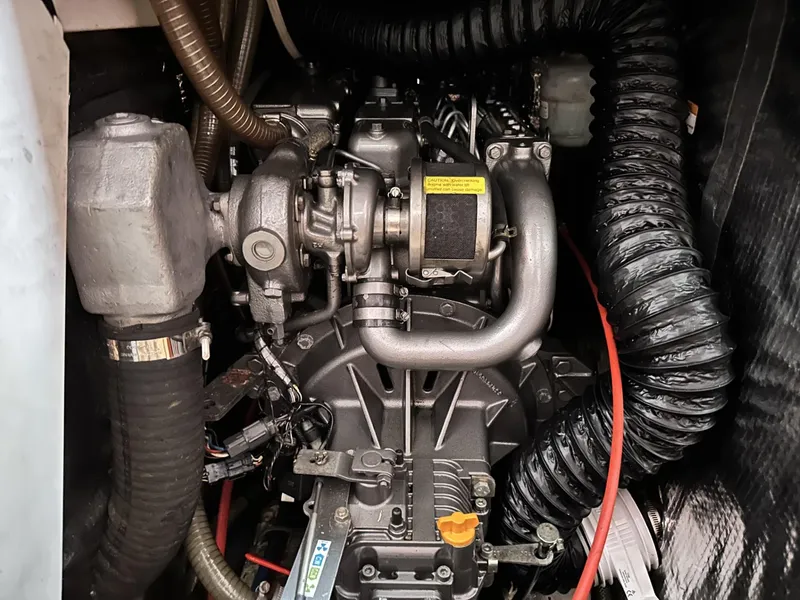 Slide: The Image of Engine compartment of a 2006 Hanse 461 sailboat, showcasing intricate mechanical components. - 36