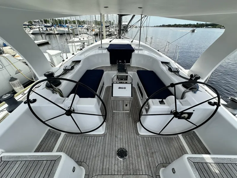 Slide: The Image of 2006 Hanse 461 yacht cockpit with dual steering wheels and teak flooring. - 4