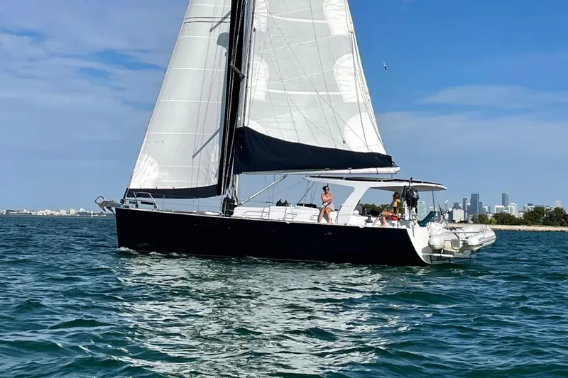 Slide: The Image of Sailing yacht Hanse 461, 2006 model, cruising on blue waters near a city skyline. - 42