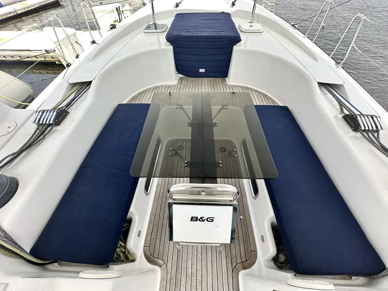 Slide: The Image of 2006 Hanse 461 yacht cockpit with blue seating and a central glass table. - 6