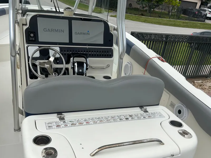 Slide: The Image of 2006 Hydra-Sports Vector 2900 CC boat cockpit with Garmin navigation system and steering wheel. - 12