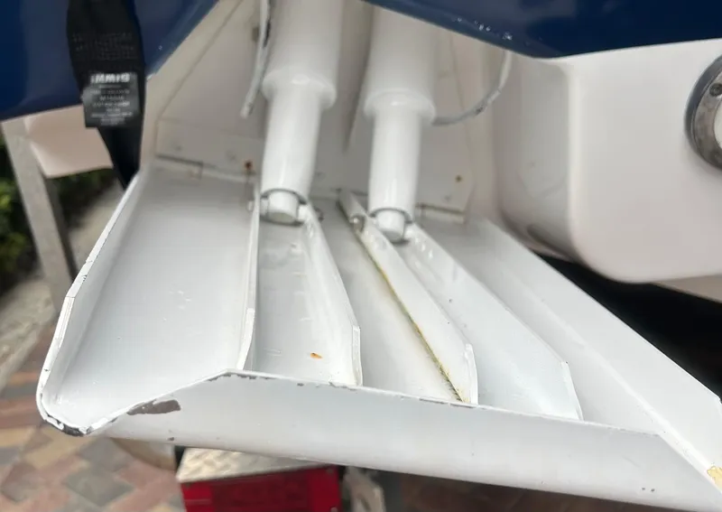 Slide: The Image of 2006 Hydra-Sports Vector 2900 CC boat detail showing trim tabs and hydraulic components. - 23