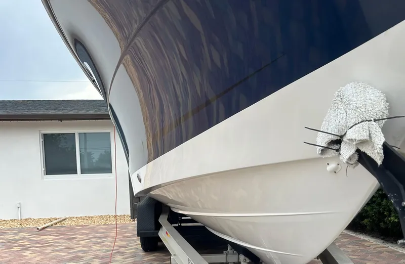 Slide: The Image of 2006 Hydra-Sports Vector 2900 CC boat on trailer, parked near a house. - 3