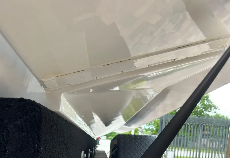 Slide: The Image of 2006 Hydra-Sports Vector 2900 CC boat hull detail, showing underside and trailer support. - 30