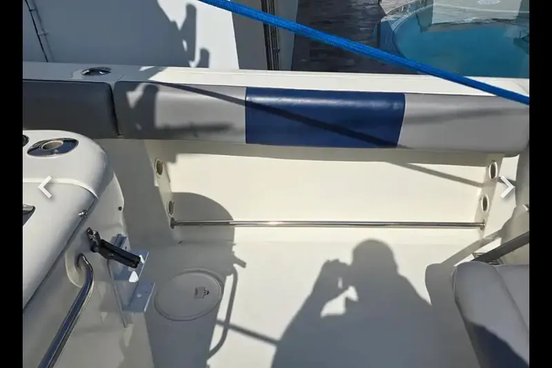 Slide: The Image of 2006 Hydra-Sports Vector 2900 CC boat interior with seating and blue accents. - 8