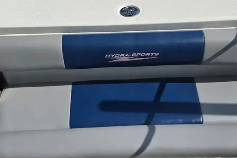 Slide: The Image of 2006 Hydra-Sports Vector 2900 CC boat seat with logo, featuring blue and gray upholstery. - 9