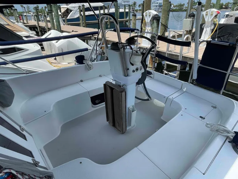 Slide: The Image of Cockpit of a 2006 Hunter 309 sailboat docked at a marina. - 13