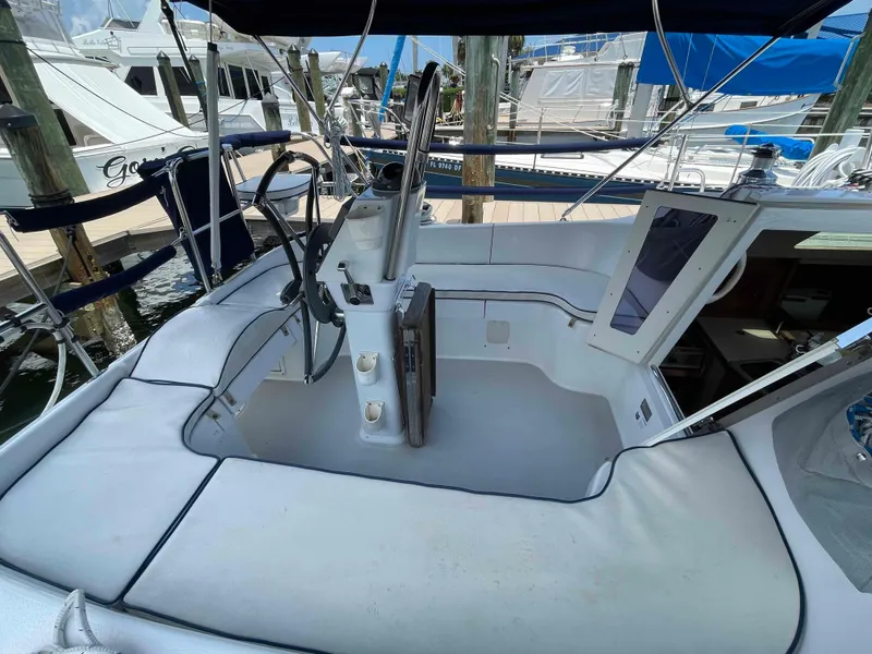 Slide: The Image of Cockpit of a 2006 Hunter 309 sailboat with steering wheel and navigation equipment. - 15
