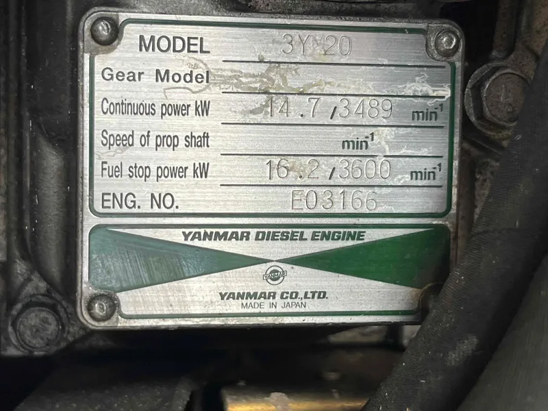 Slide: The Image of Yanmar diesel engine plate with specifications, model 3YM20, continuous power 14.7 kW. - 21