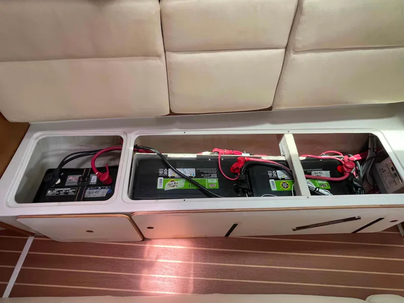 Slide: The Image of Battery compartment of a 2006 Hunter 309 boat with three batteries installed. - 34