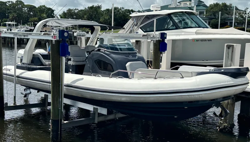 The Image of 2024 Zodiac Medline 9 boat docked at marina, featuring sleek design and modern amenities. - 0