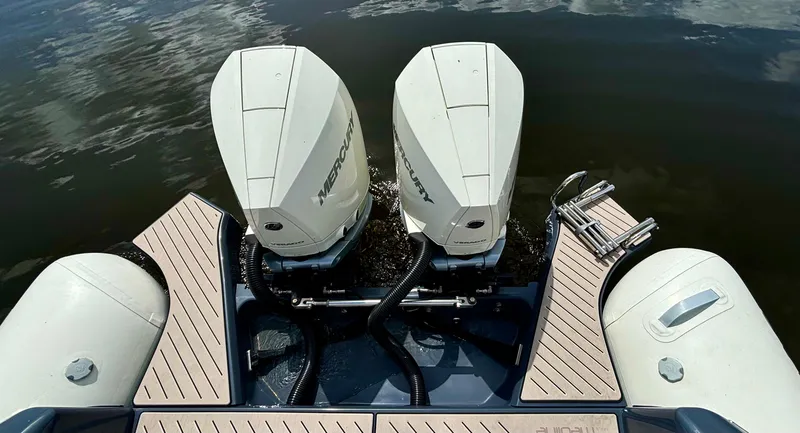 Slide: The Image of 2024 Zodiac Medline 9 boat with dual Mercury outboard engines on water. - 11
