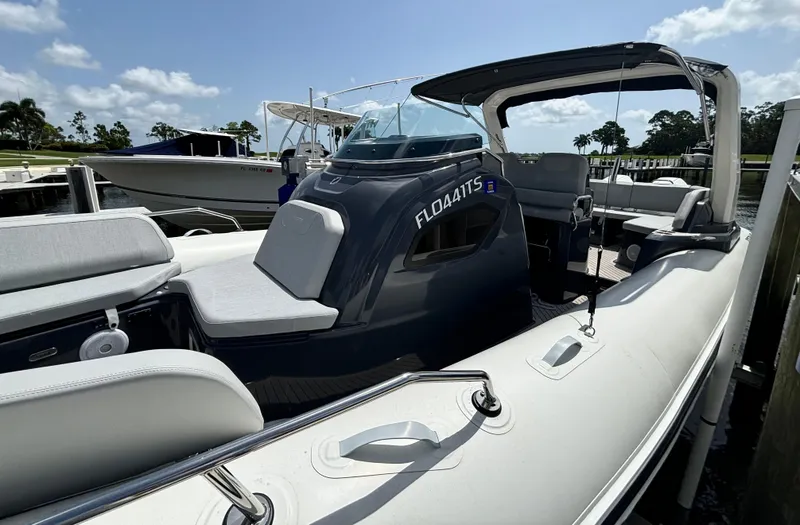 Slide: The Image of 2024 Zodiac Medline 9 boat docked, featuring sleek design and spacious seating. - 2
