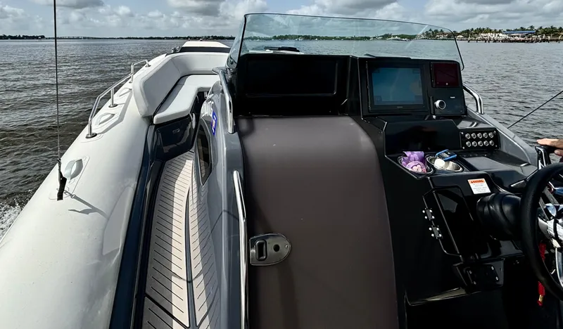 Slide: The Image of 2024 Zodiac Medline 9 boat on water, featuring sleek design and modern dashboard. - 5