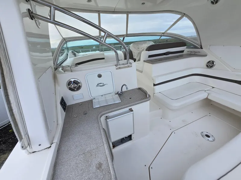Slide: The Image of 2008 Rinker 400 Express Cruiser interior with seating and helm, featuring sleek design and modern amenities. - 31