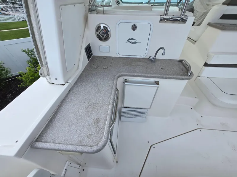 Slide: The Image of 2008 Rinker 400 Express Cruiser wet bar with sink and storage. - 33