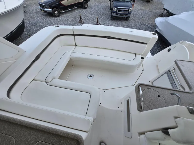 Slide: The Image of 2008 Rinker 400 Express Cruiser with spacious white seating area. - 36