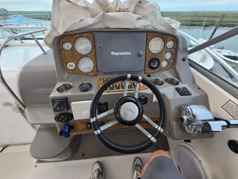 Slide: The Image of 2008 Rinker 400 Express Cruiser helm with Raymarine navigation system and gauges. - 38