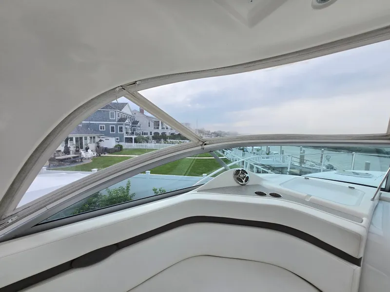 Slide: The Image of 2008 Rinker 400 Express Cruiser interior with scenic waterfront view. - 43